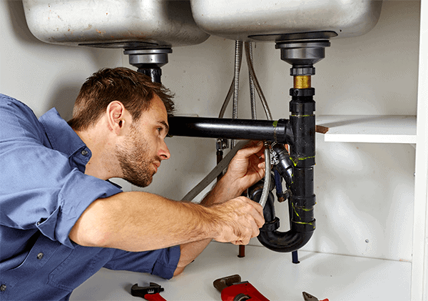 Plumber Repairing Sink Drain