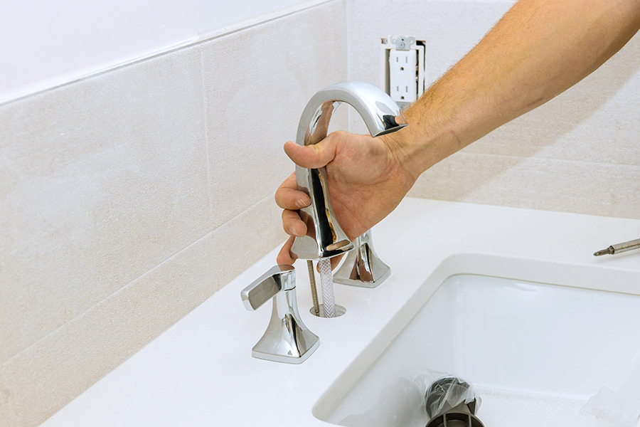 Faucet installation in bathroom sink