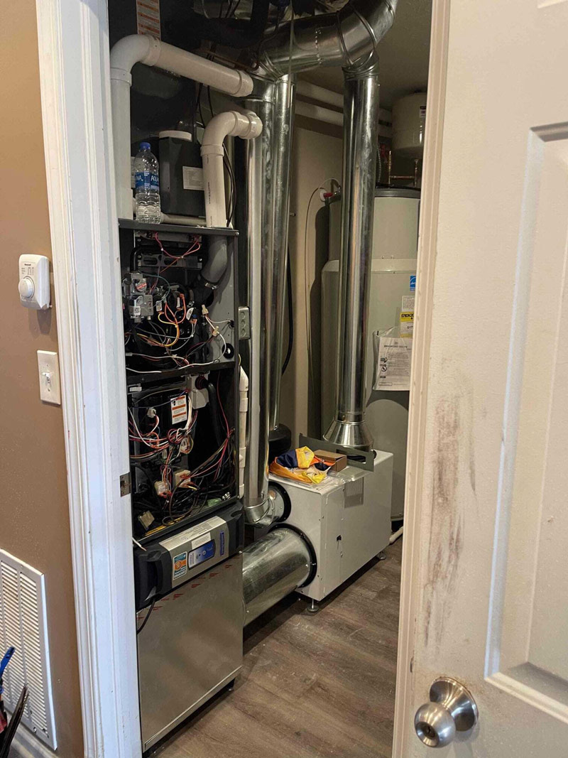Furnace repair in utility closet